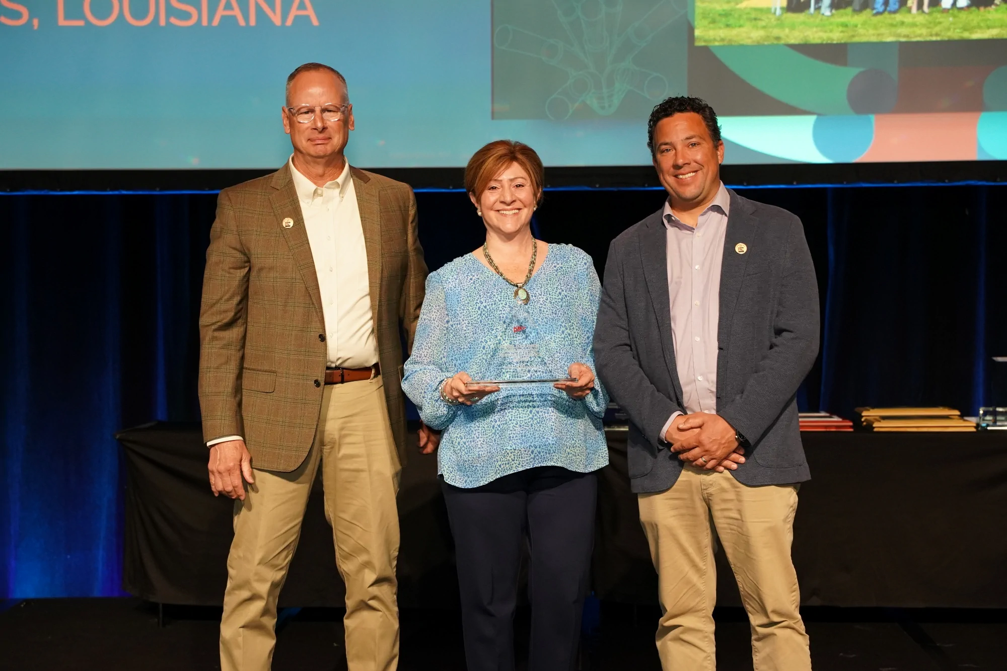 Kimberly Schlichting, President and CEO of the Delaware Municipal Electric Corporation holding the Harold Kramer-John Preston Personal Service Award recipient at the American Public Power Association’s (APPA) National Conference.