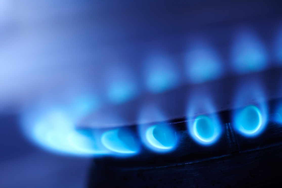 Blue flame on a burner, symbolizing an electric and natural gas consulting service offered by AMPO, Inc.