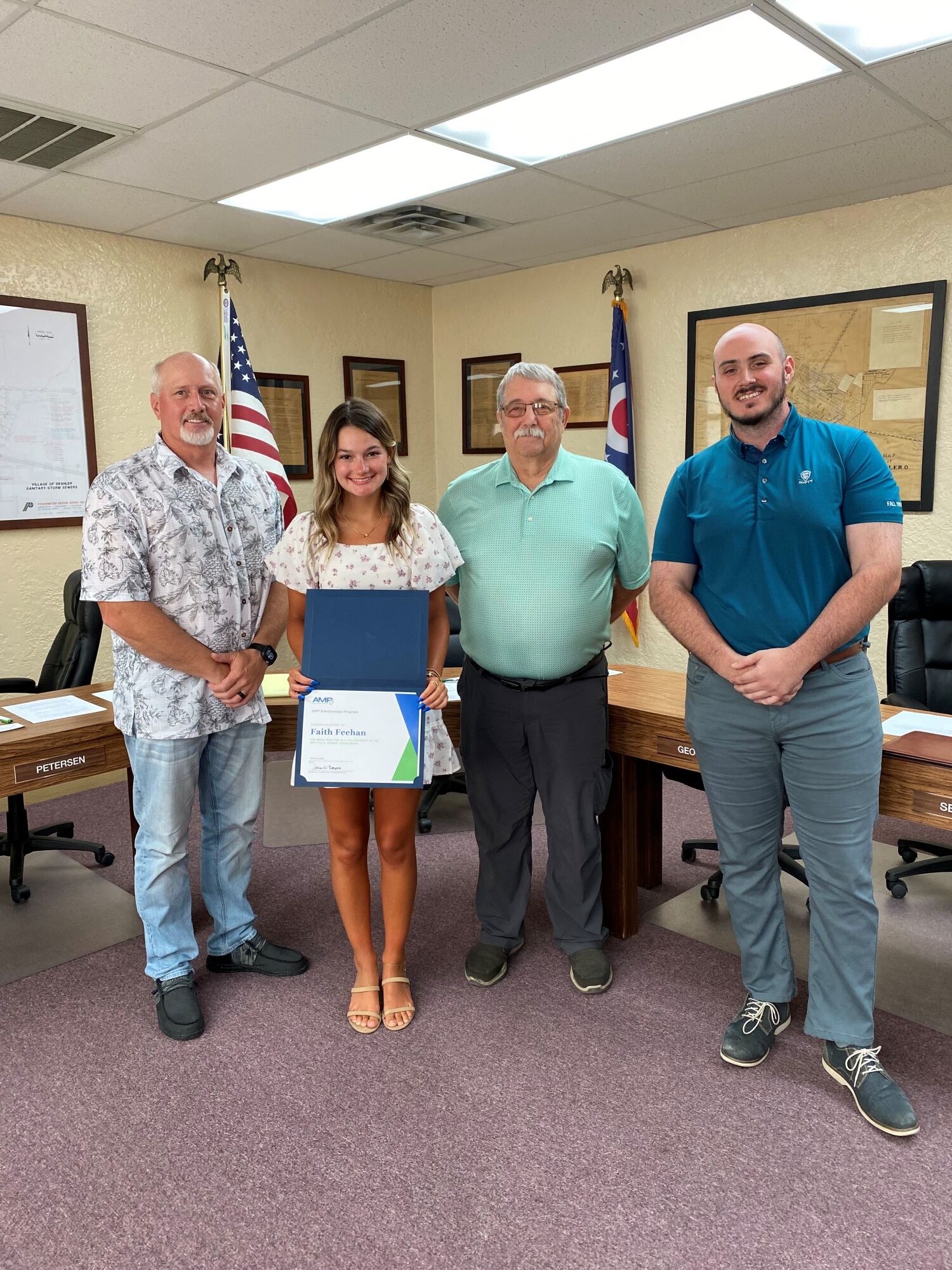A young woman accepting an AMP scholarship.